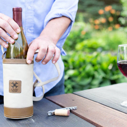 Casali Toscana leather wine carrier in a warm lifestyle setting