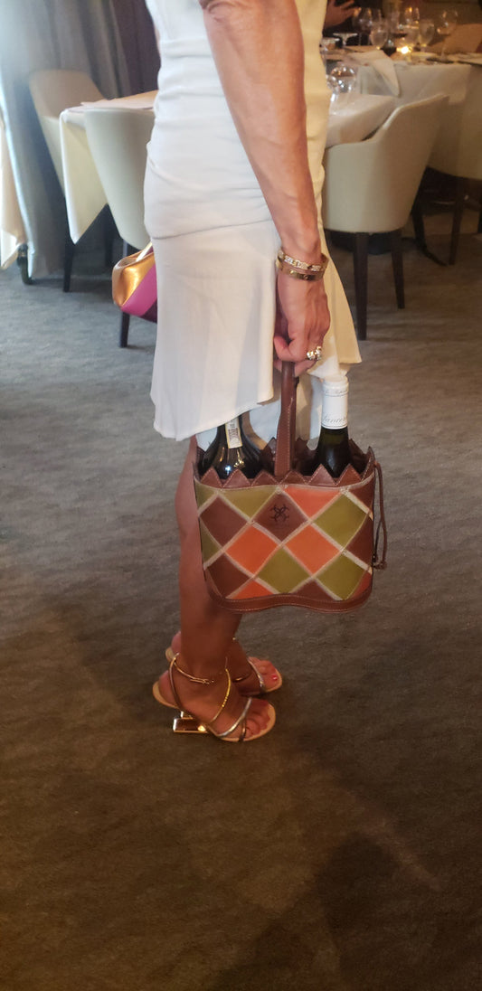 Person carrying Casali double mosaic leather wine tote